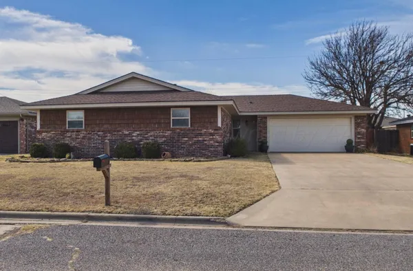 a front view of a house with garage
