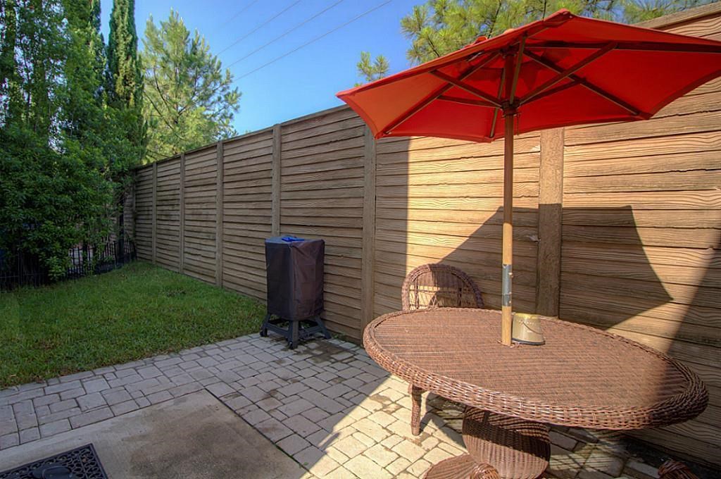 1246 Glenwood Canyon Lane Houston, TX 77077 - Photo 20 of 21 a backyard of a house with seating space