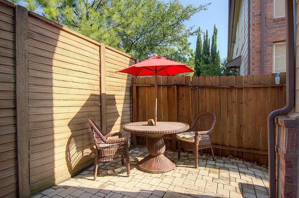 1246 Glenwood Canyon Lane Houston, TX 77077 - Photo 21 of 21 a patio with a table and chairs