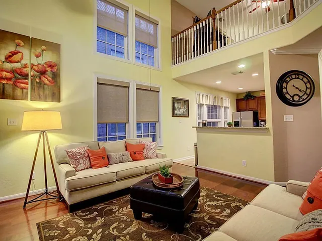 a living room with furniture and a rug