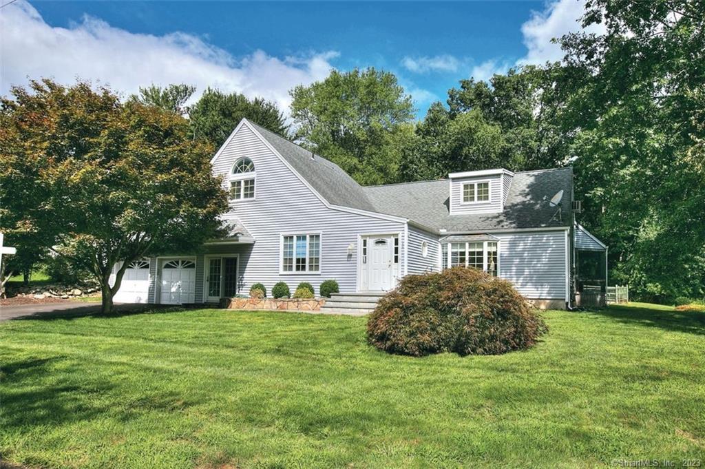 44 Winslow Road Trumbull, CT 06611 - Photo 1 of 1 a house that has a big yard with large trees