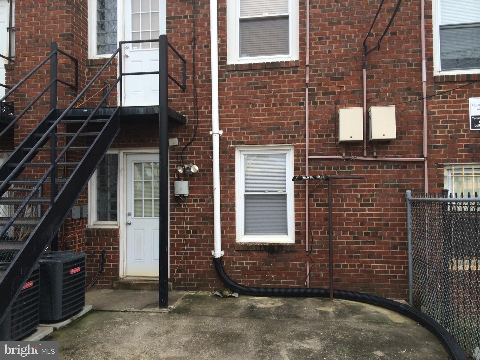 1226 Simms Place Northeast Washington, DC 20002 - Photo 15 of 15 a view of a brick house with many windows