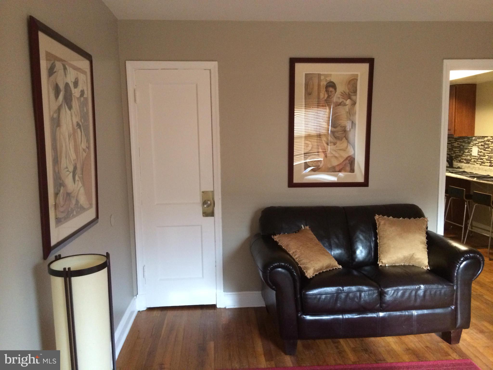 1226 Simms Place Northeast Washington, DC 20002 - Photo 4 of 15 a living room with furniture and a window
