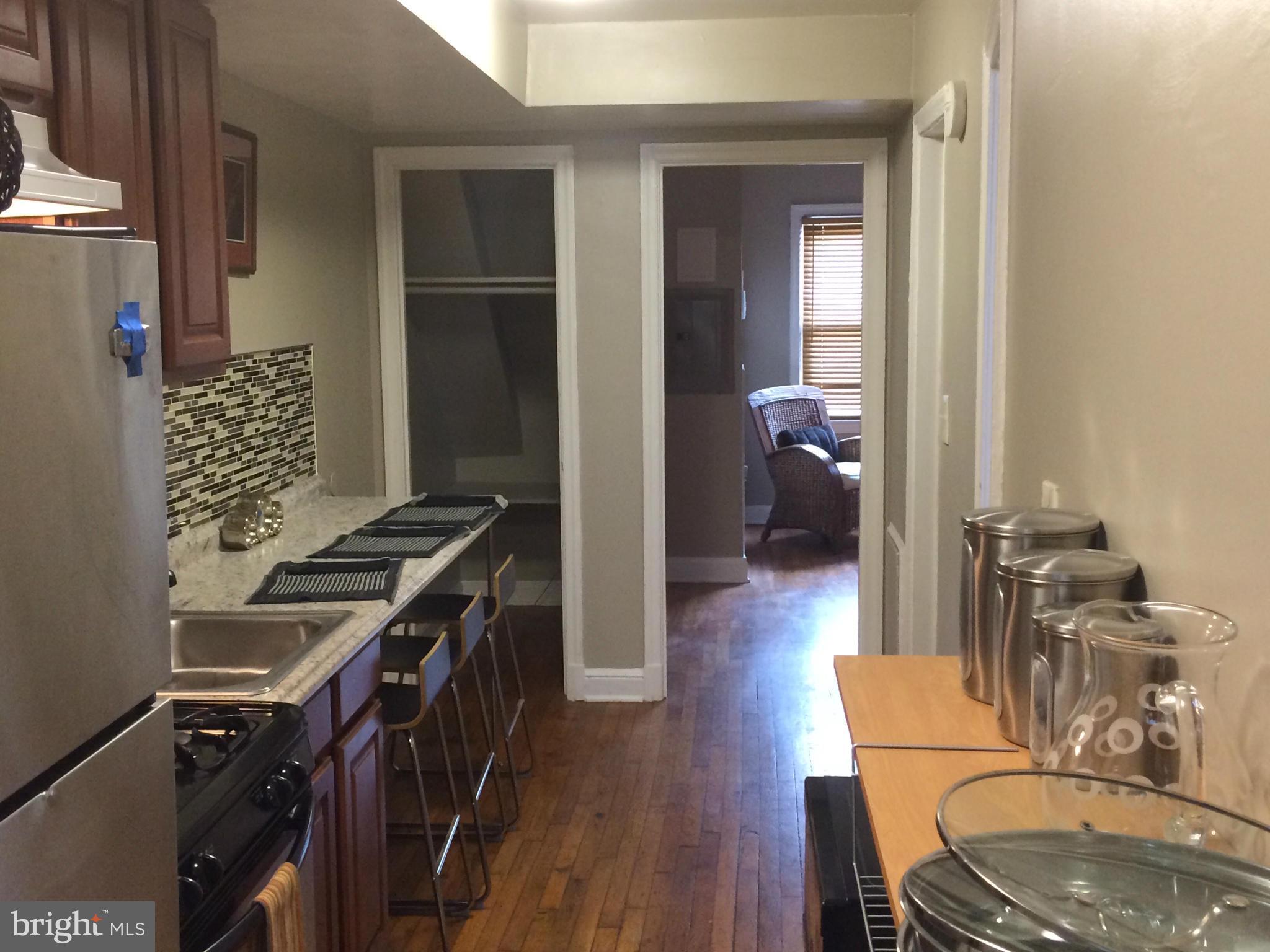 1226 Simms Place Northeast Washington, DC 20002 - Photo 8 of 15 a view of a livingroom with furniture and wooden floor