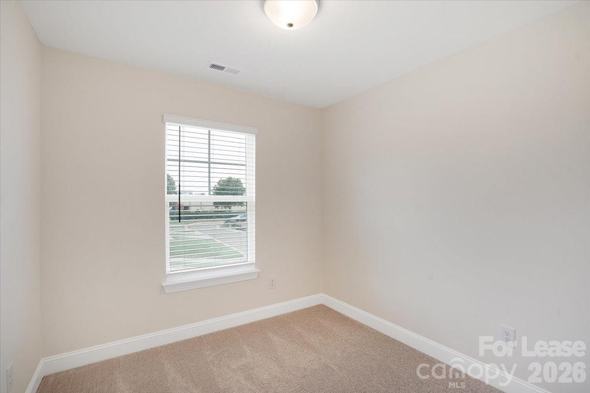 5569 Stafford Road Charlotte, NC 28215 - Photo 16 of 29 an empty room with windows