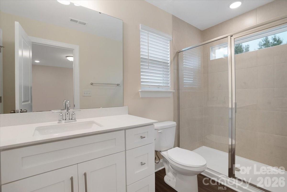 5569 Stafford Road Charlotte, NC 28215 - Photo 27 of 29 a bathroom with a sink toilet and shower