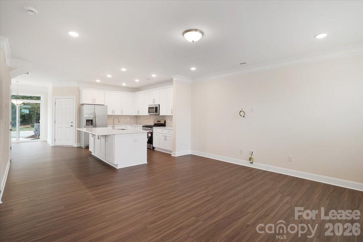 5569 Stafford Road Charlotte, NC 28215 - Photo 4 of 29 a view of kitchen with wooden floor