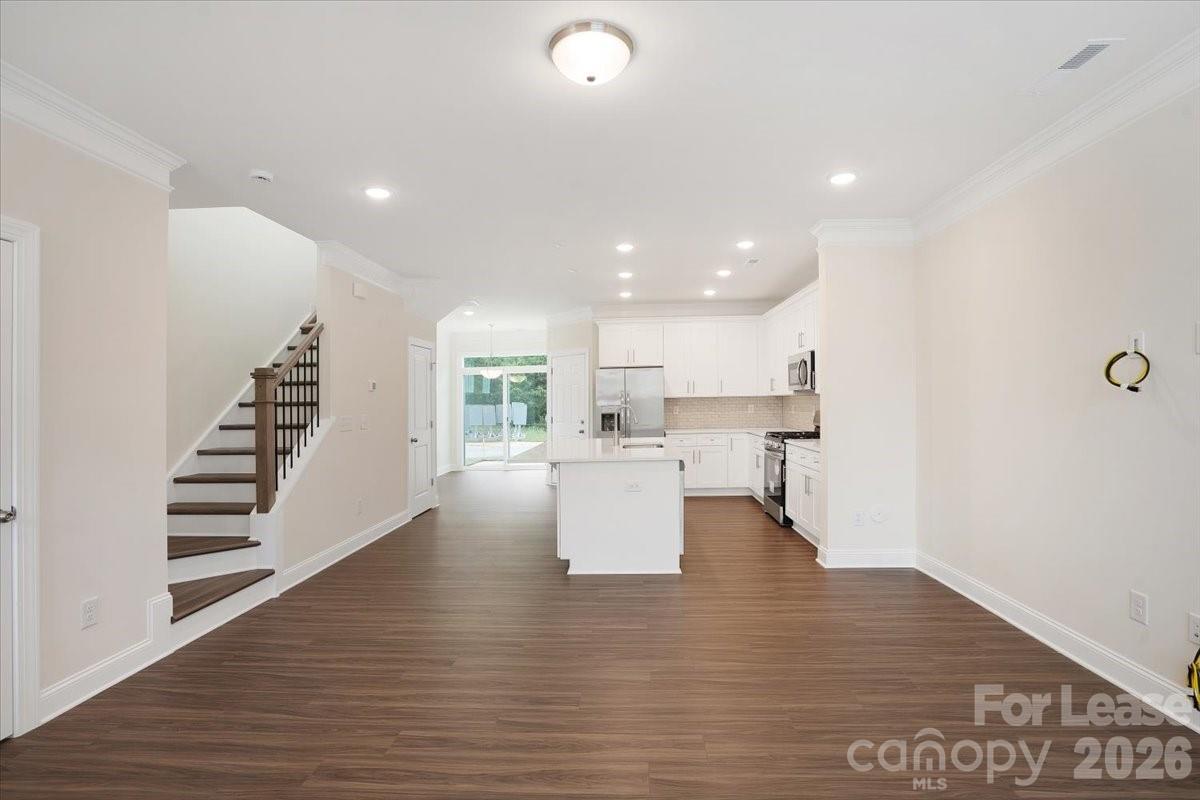 5569 Stafford Road Charlotte, NC 28215 - Photo 5 of 29 a view of kitchen with furniture and wooden floor
