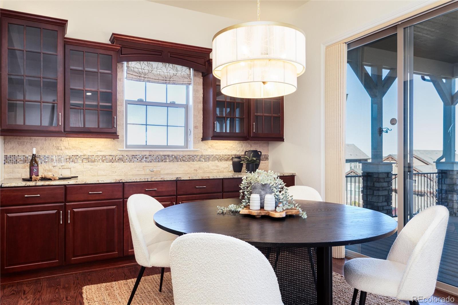 10698 Mountaingate Court Highlands Ranch, CO 80126 - Photo 18 of 47 a view of a dining room with furniture