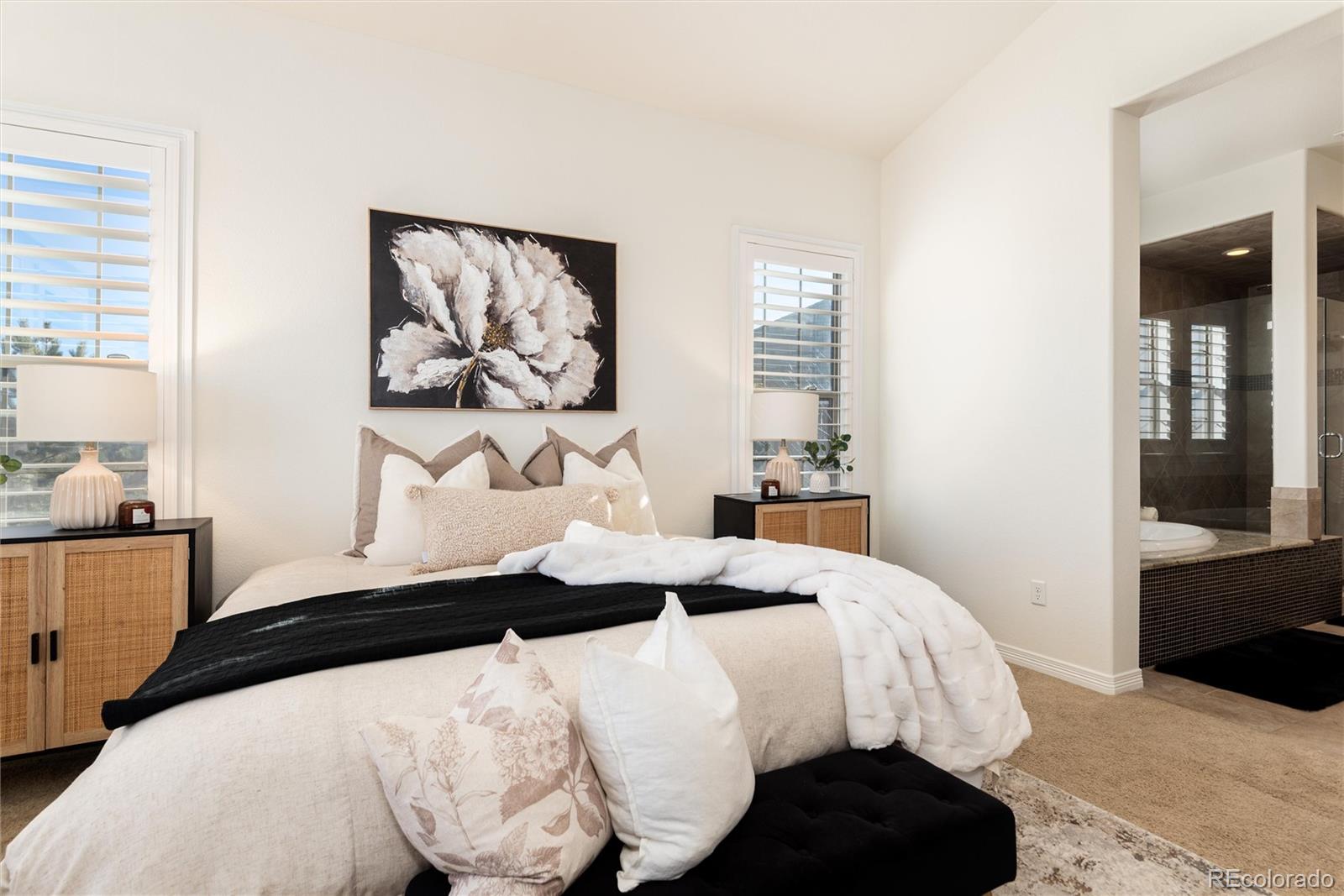 10698 Mountaingate Court Highlands Ranch, CO 80126 - Photo 21 of 47 a bedroom with a bed and wall painting