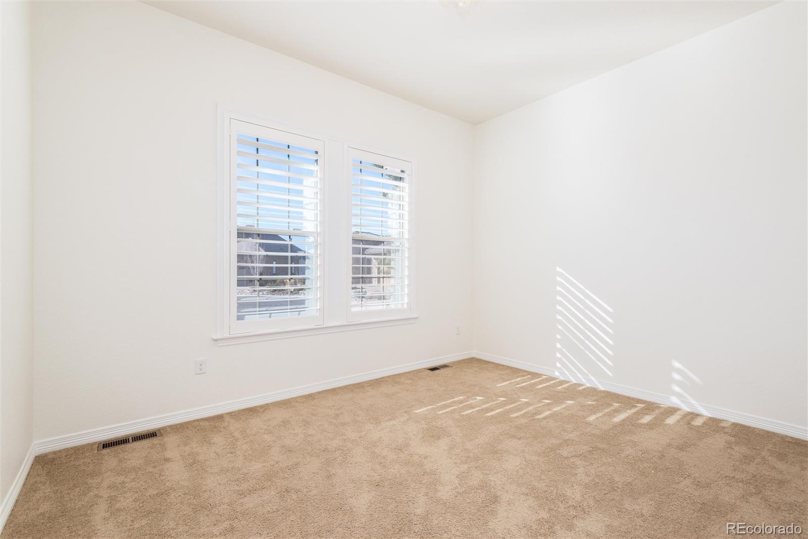 10698 Mountaingate Court Highlands Ranch, CO 80126 - Photo 36 of 47 an empty room with a window