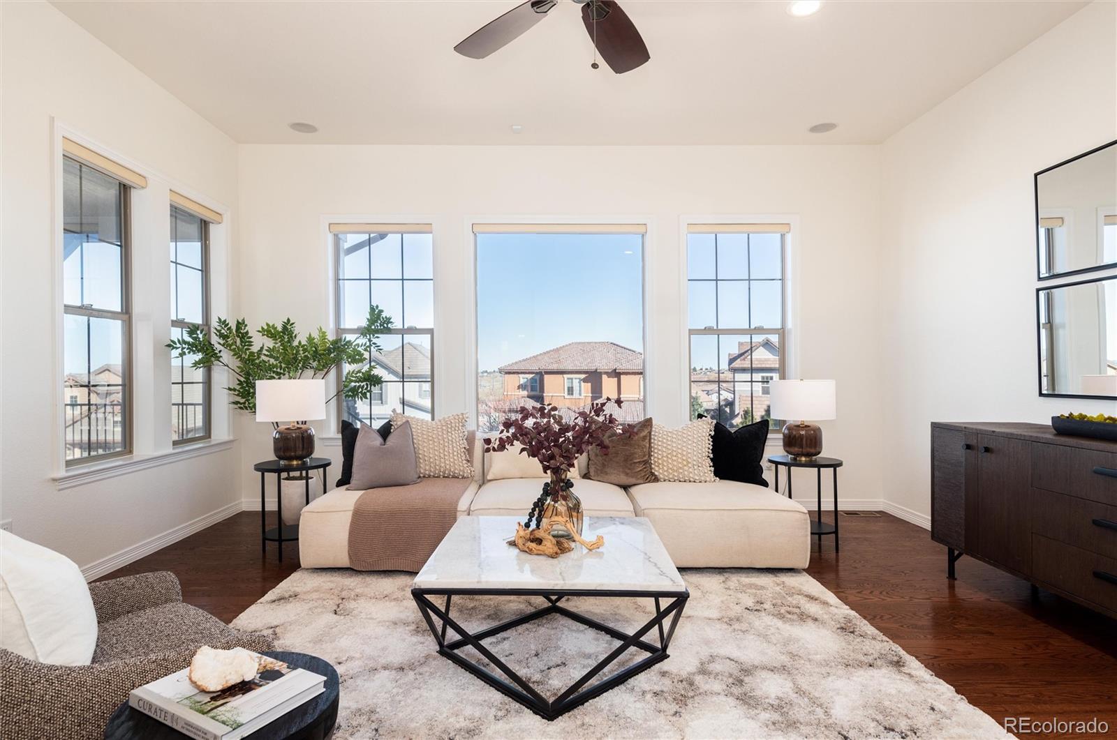 10698 Mountaingate Court Highlands Ranch, CO 80126 - Photo 4 of 47 a living room with furniture