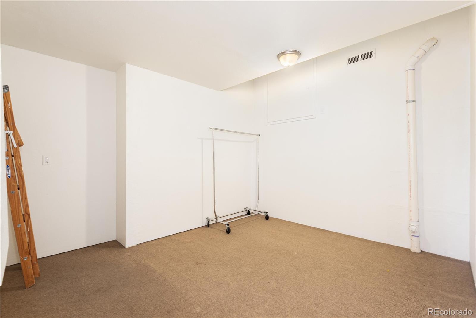 10698 Mountaingate Court Highlands Ranch, CO 80126 - Photo 44 of 47 a view of a room with drop ceiling