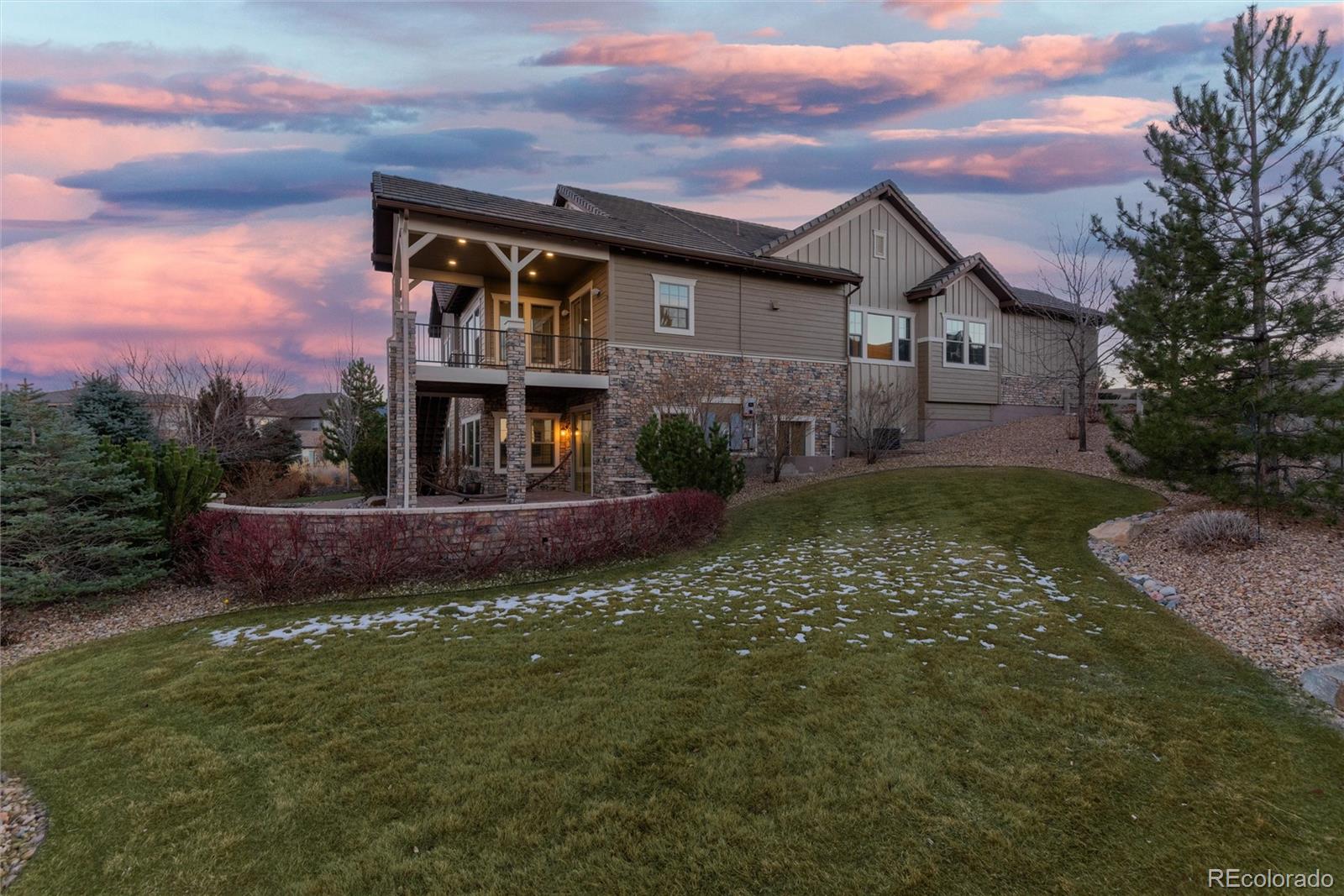 10698 Mountaingate Court Highlands Ranch, CO 80126 - Photo 46 of 47 a front view of a house with a garden
