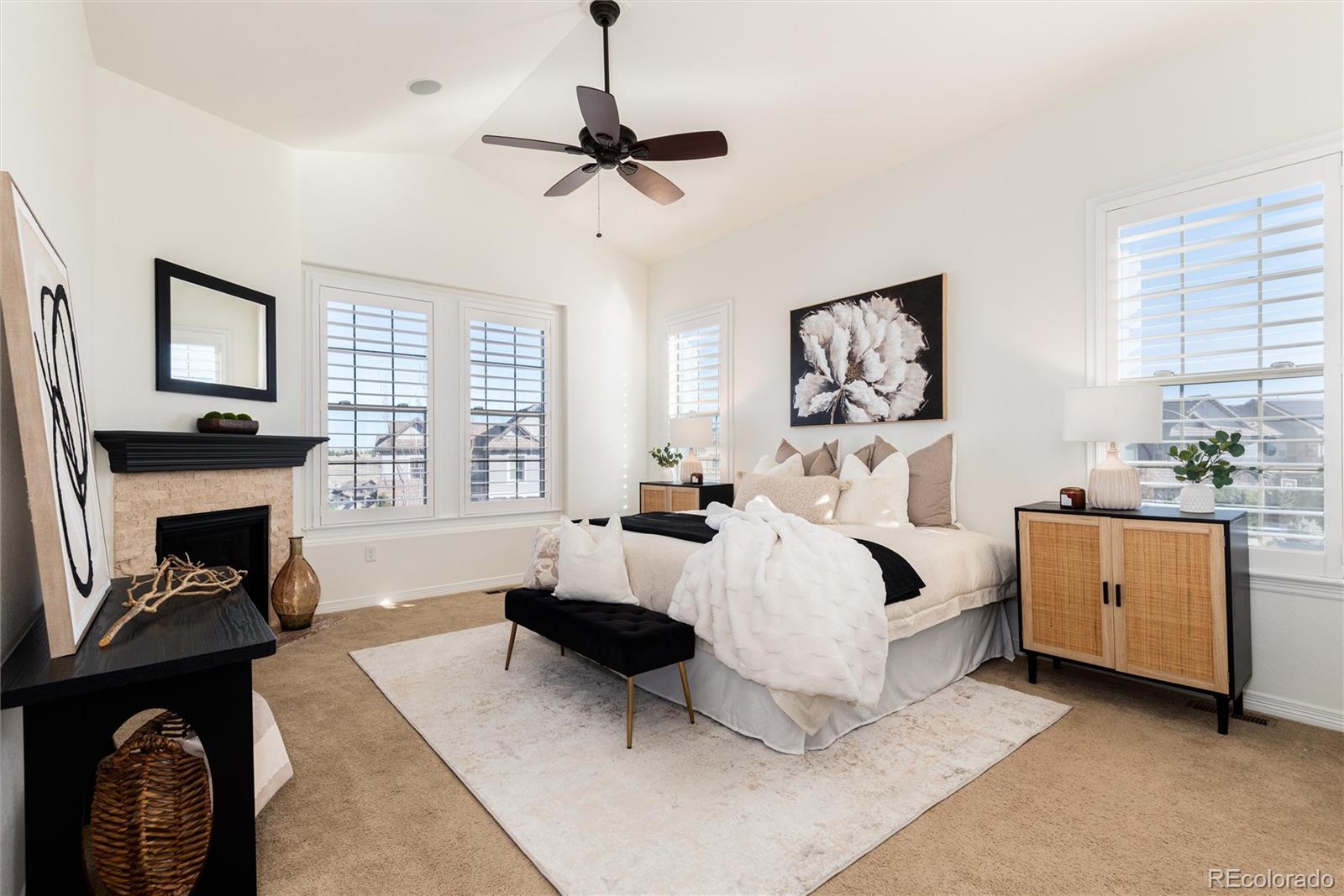 10698 Mountaingate Court Highlands Ranch, CO 80126 - Photo 8 of 47 a bed room with a bed and a fireplace