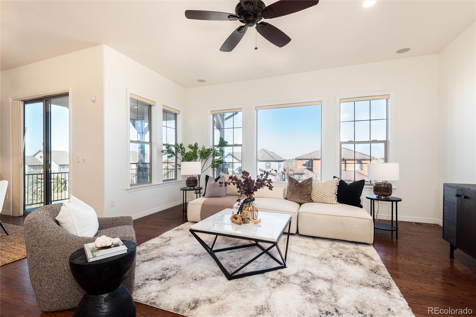 10698 Mountaingate Court Highlands Ranch, CO 80126 - Photo 9 of 47 a living room with furniture and a window
