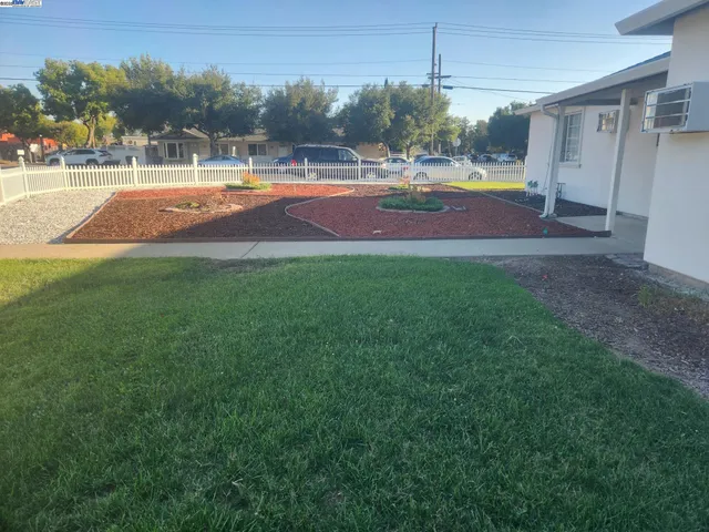 a view of yard with swimming pool outdoor seating and yard