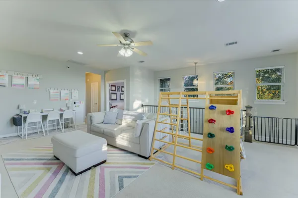 a bedroom with furniture and a large window