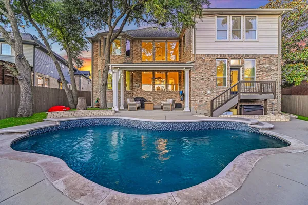 a view of a house with swimming pool