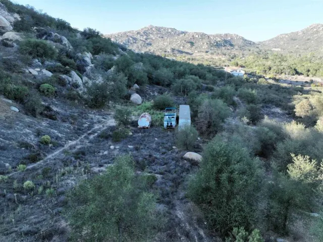 a view of a town with mountains in the background