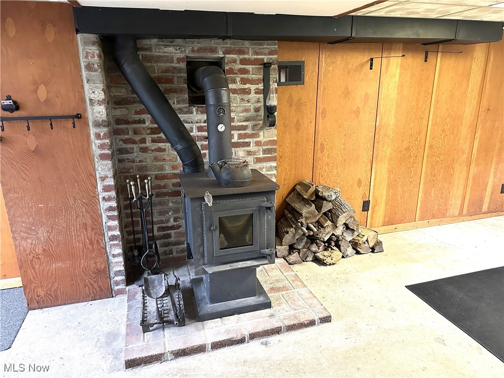 14720 Old State Road Middlefield, OH 44062 - Photo 23 of 36 Wood burning stove in basement helps with heating cost. Could be finished into cozy Rec. area.
