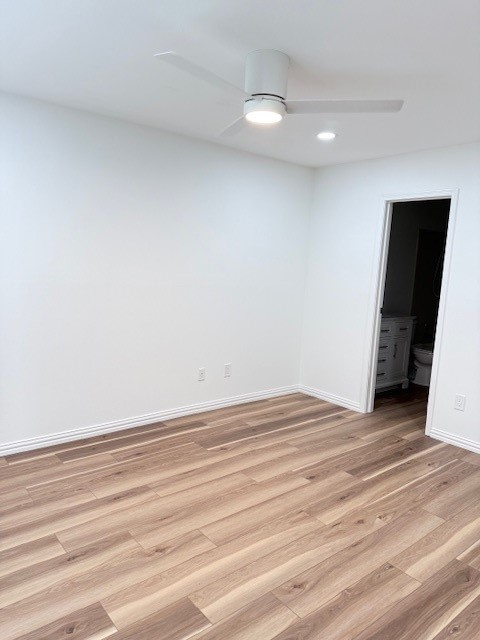 8787 Brae Acres Road, Unit 607 Houston, TX 77074 - Photo 8 of 14 Bedroom with recessed lighting, door to private bath