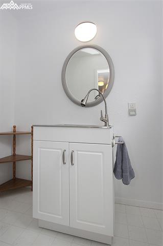 10265 Shoup Road Colorado Springs, CO 80908 - Photo 20 of 25 Half bath includes a utility sink