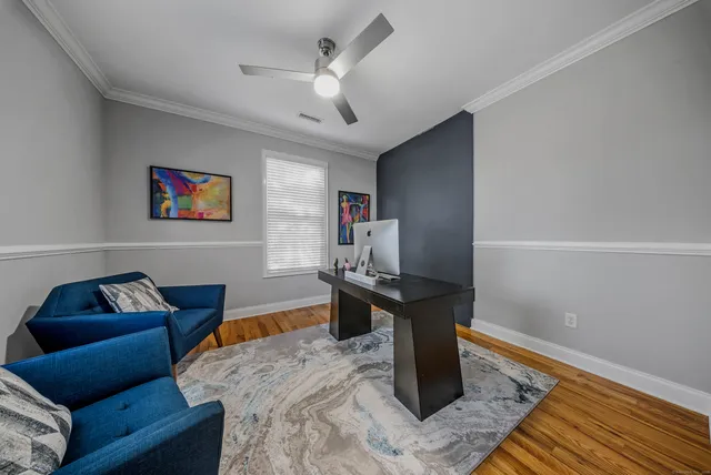 a living room with furniture and a rug