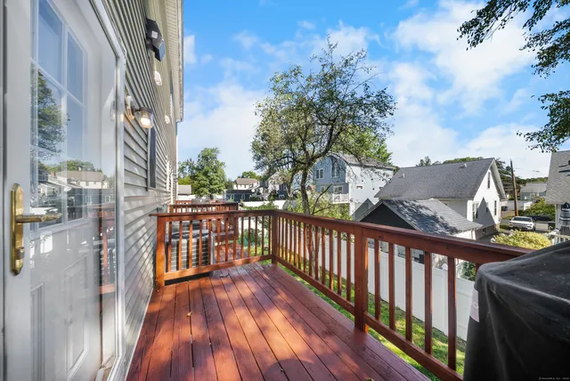 a view of a balcony with wooden floor