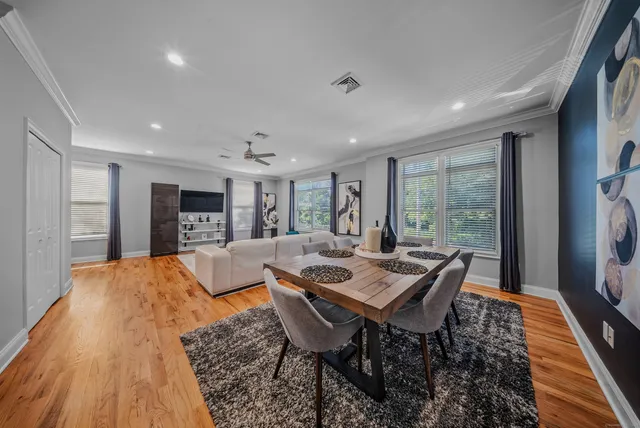a view of a dining room with furniture window and wooden floor