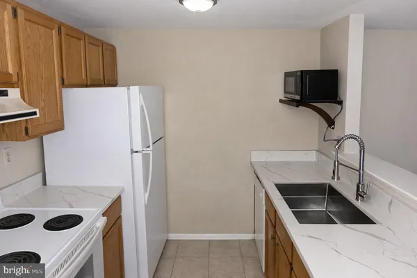 a view of livingroom with furniture and workspace