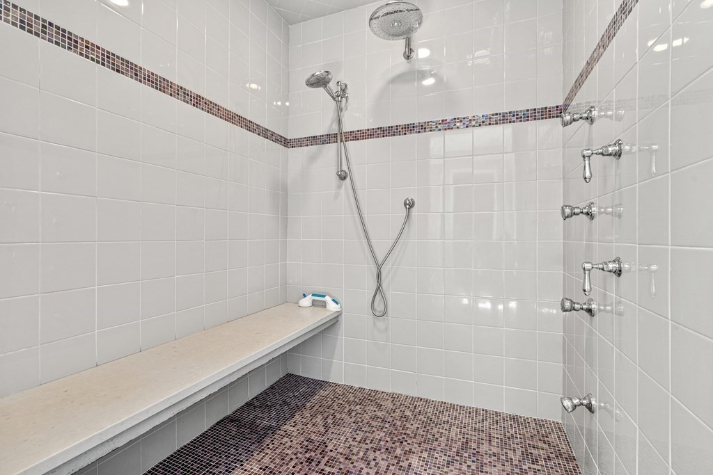 7 Coltsway, Unit 7 Wayland, MA 01778 - Photo 15 of 26 a bathroom with a shower and a bath tub