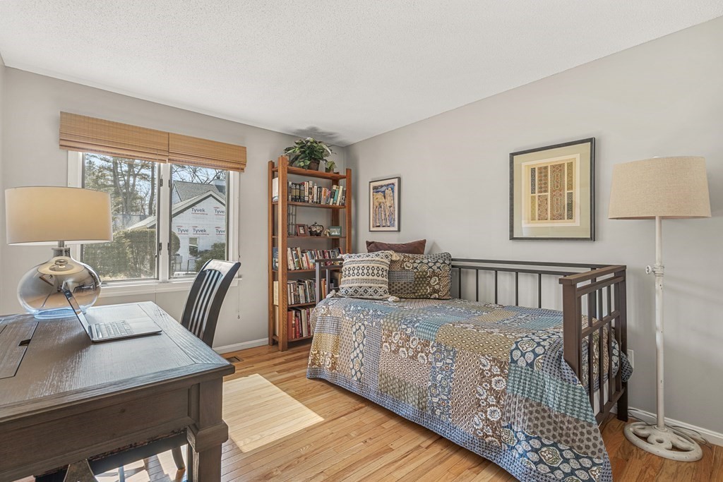 7 Coltsway, Unit 7 Wayland, MA 01778 - Photo 16 of 26 a bedroom with furniture and a large window