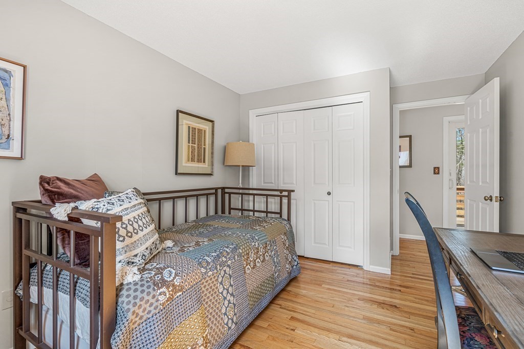 7 Coltsway, Unit 7 Wayland, MA 01778 - Photo 17 of 26 a bed sitting in a bedroom next to a window