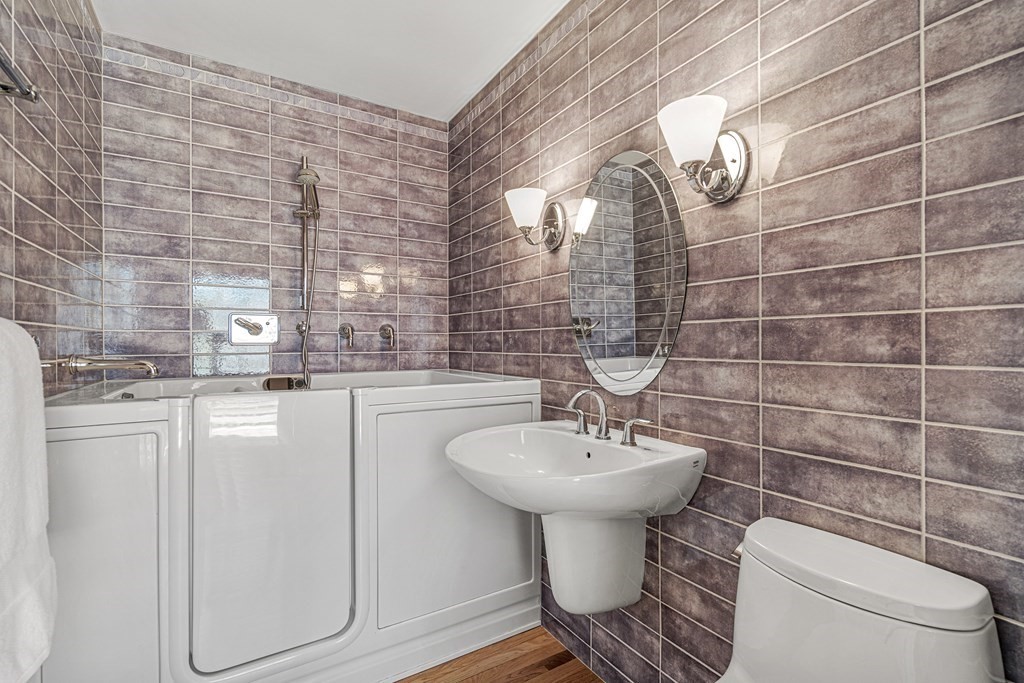 7 Coltsway, Unit 7 Wayland, MA 01778 - Photo 18 of 26 a bathroom with a sink toilet and mirror