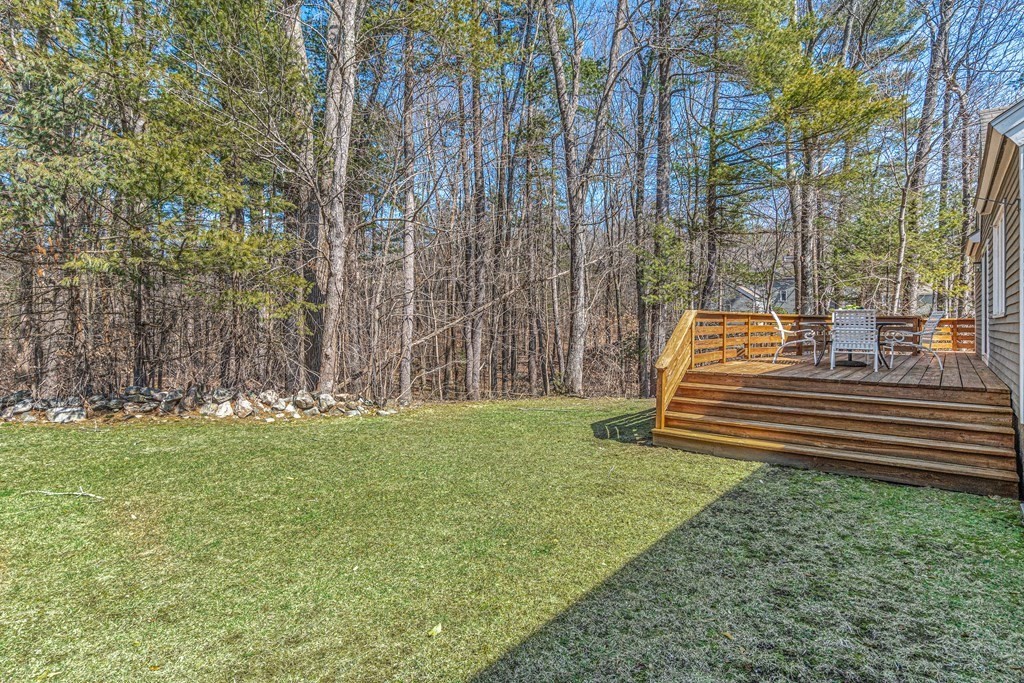 7 Coltsway, Unit 7 Wayland, MA 01778 - Photo 23 of 26 a view of a bench in a garden