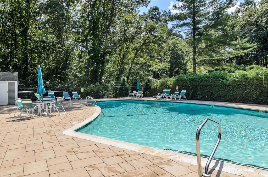 7 Coltsway, Unit 7 Wayland, MA 01778 - Photo 25 of 26 a view of a backyard with sitting area