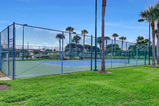 a view of a house with backyard sitting area and garden