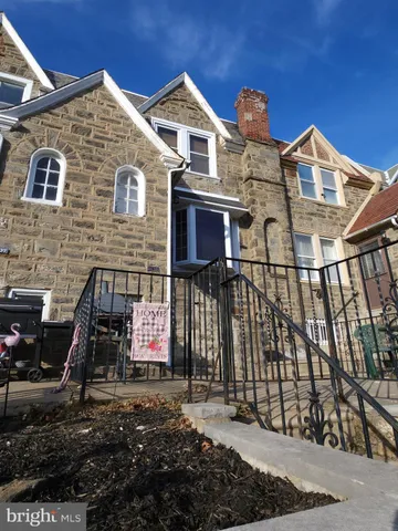 a view of a brick house with many windows