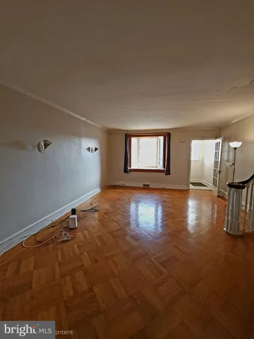a view of a livingroom with wooden floor