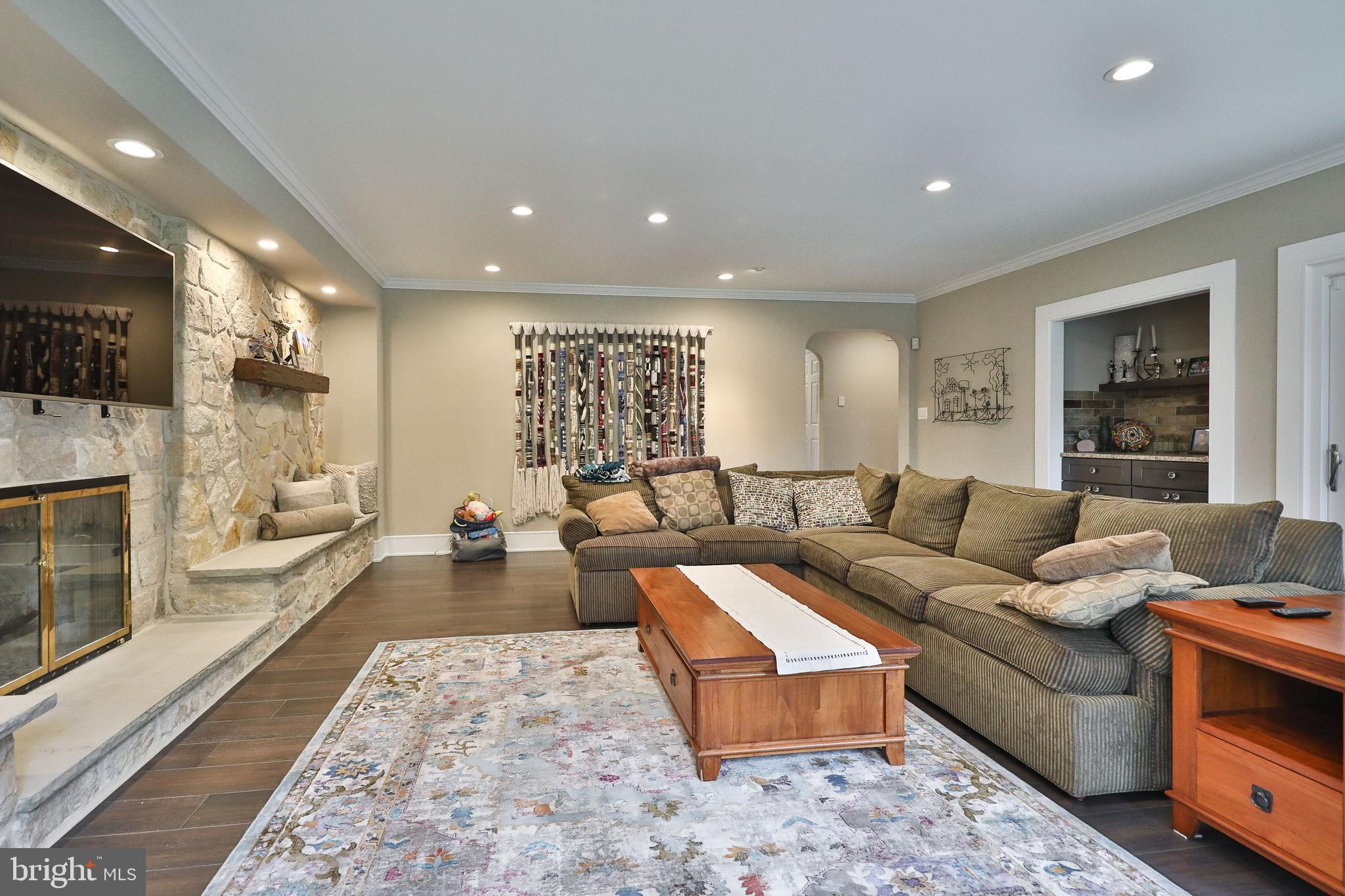 1966 Heritage Road Huntingdon Valley, PA 19006 - Photo 22 of 48 Great Room with Stone wall and custom bar