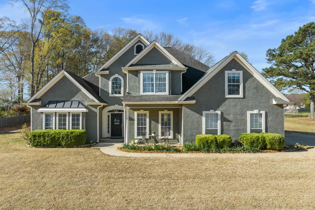 81 Pheasant Ridge Newnan, GA 30265 - Photo 1 of 1 a front view of a house with a yard