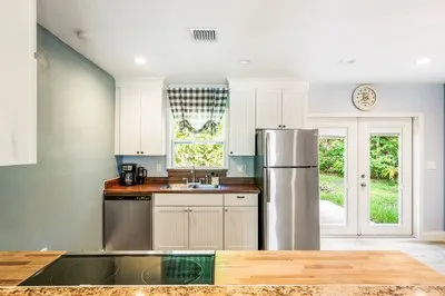 a kitchen with a sink and a refrigerator