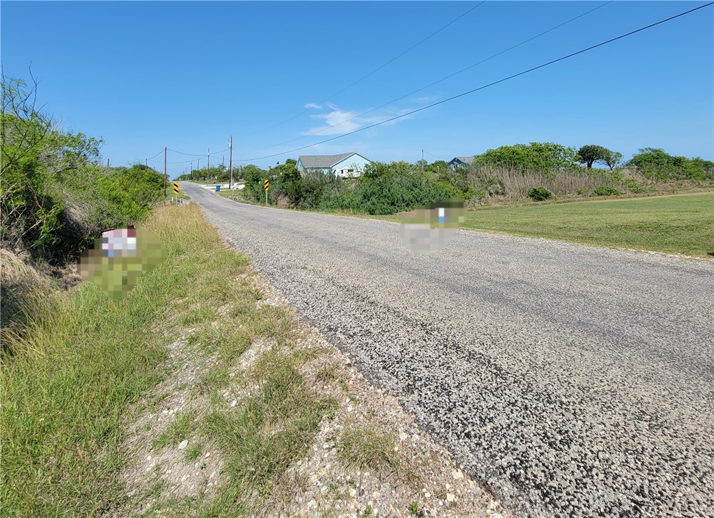 1713 1st Street Bayside, TX 78340 - Photo 13 of 17 a view of a field with trees in background