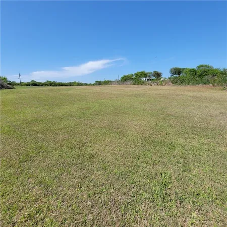 a view of a ocean with a building in the background