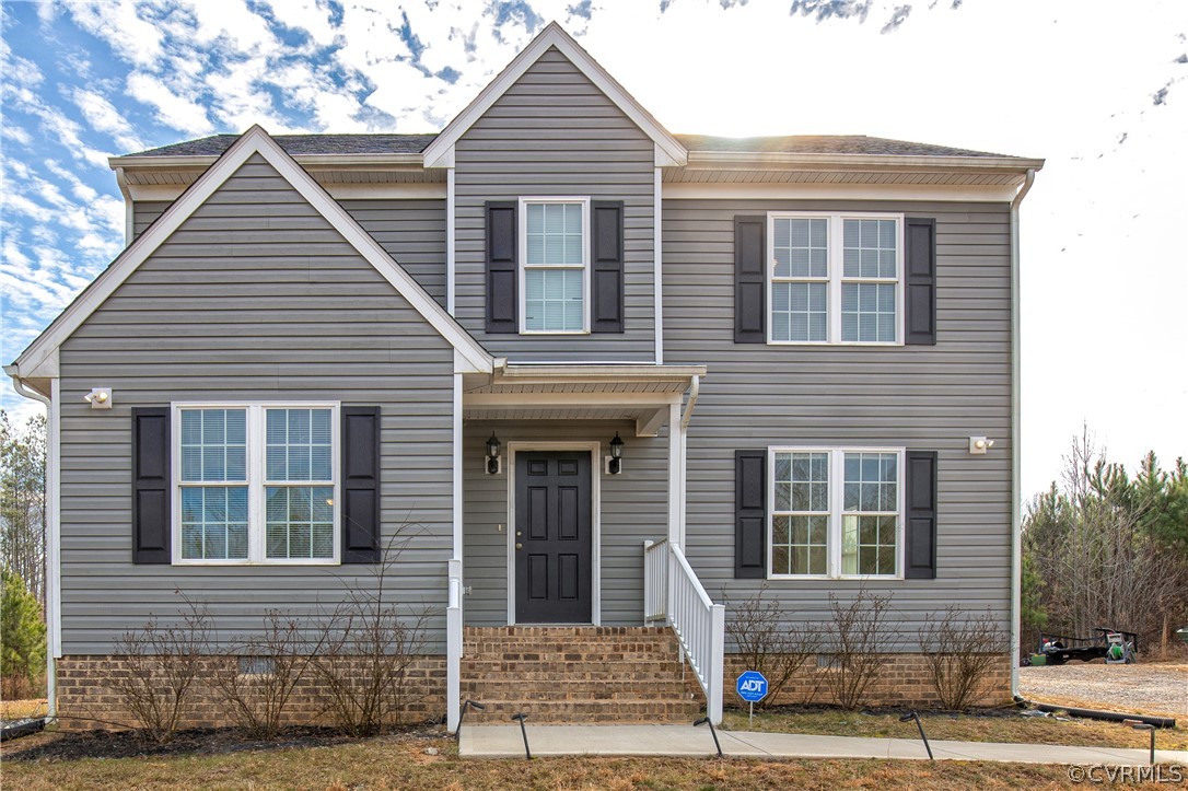 18951 Lundys Road Dinwiddie, VA 23841 - Photo 1 of 27 a front view of a house with street