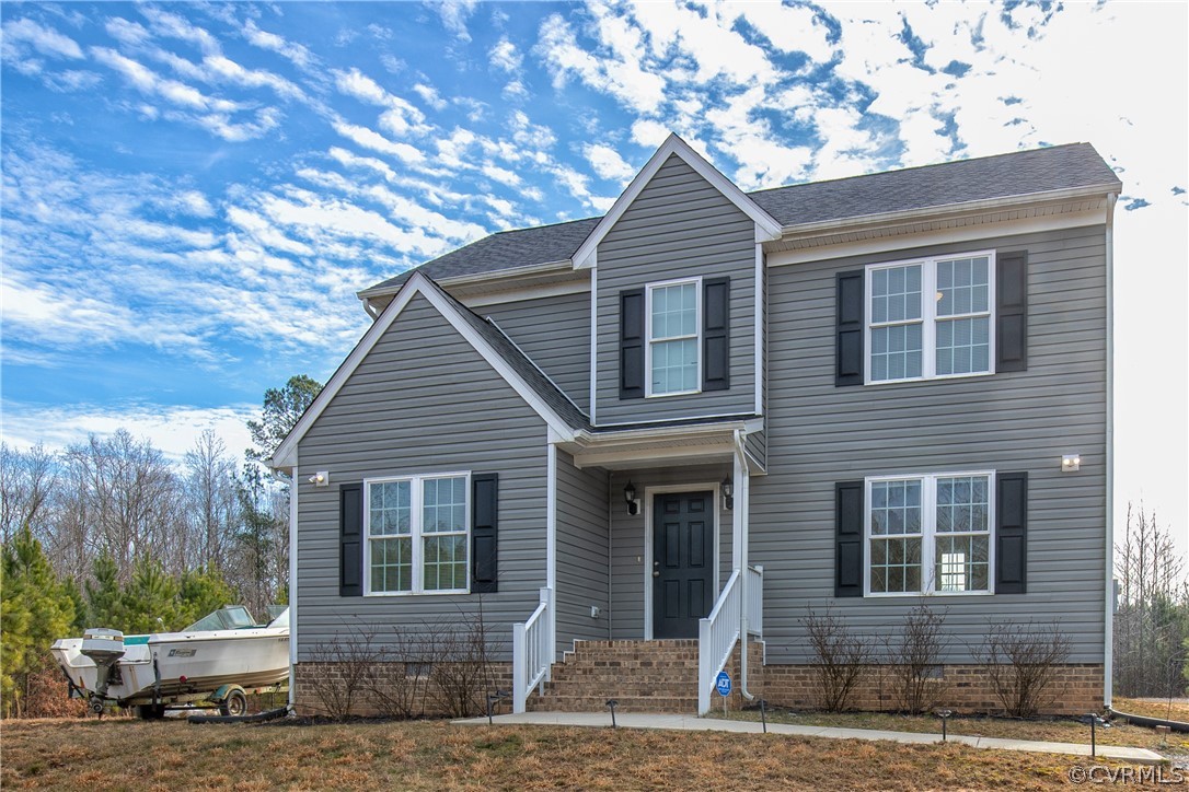 18951 Lundys Road Dinwiddie, VA 23841 - Photo 21 of 27 a front view of a house with garden