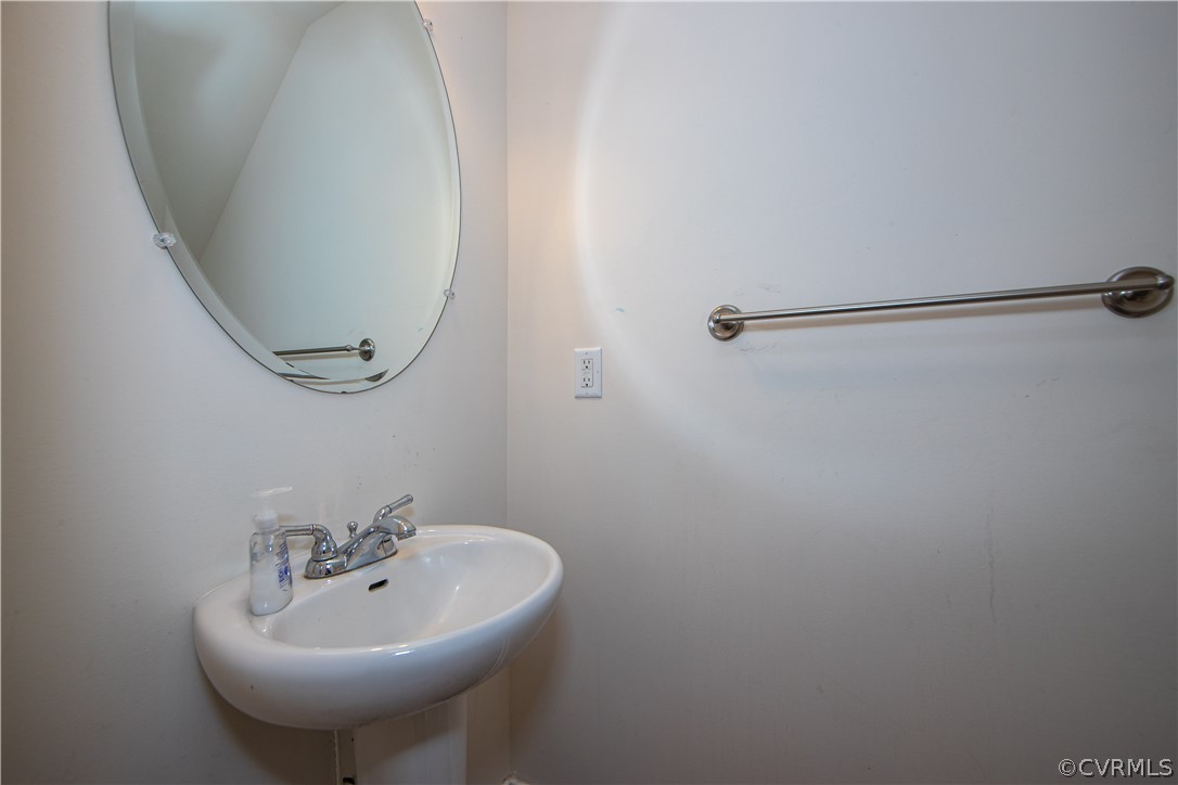 18951 Lundys Road Dinwiddie, VA 23841 - Photo 6 of 27 a bathroom with a sink and mirror