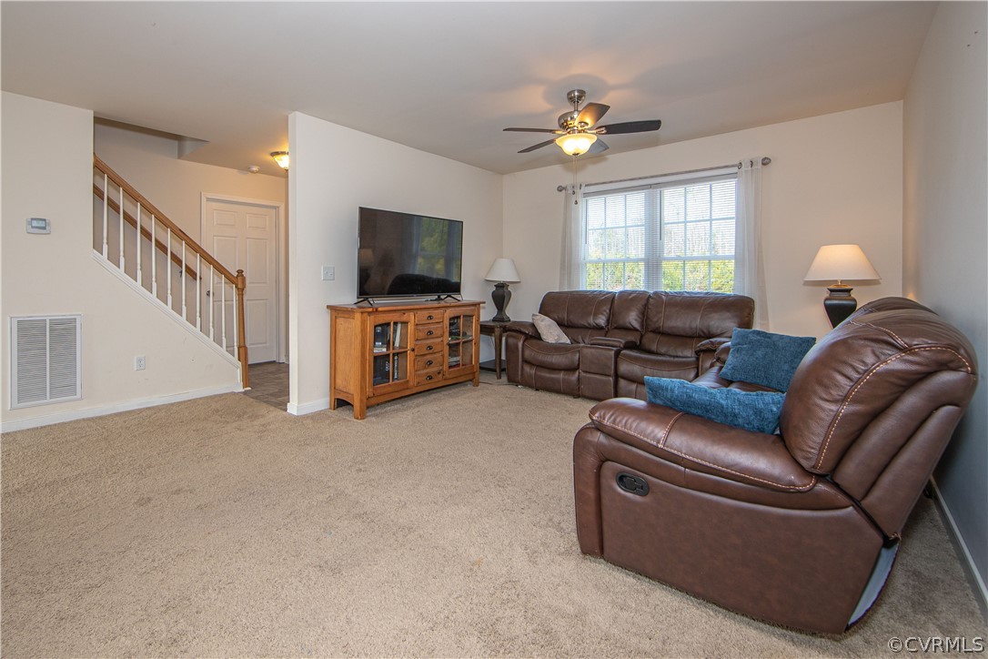 18951 Lundys Road Dinwiddie, VA 23841 - Photo 7 of 27 a living room with furniture and a flat screen tv