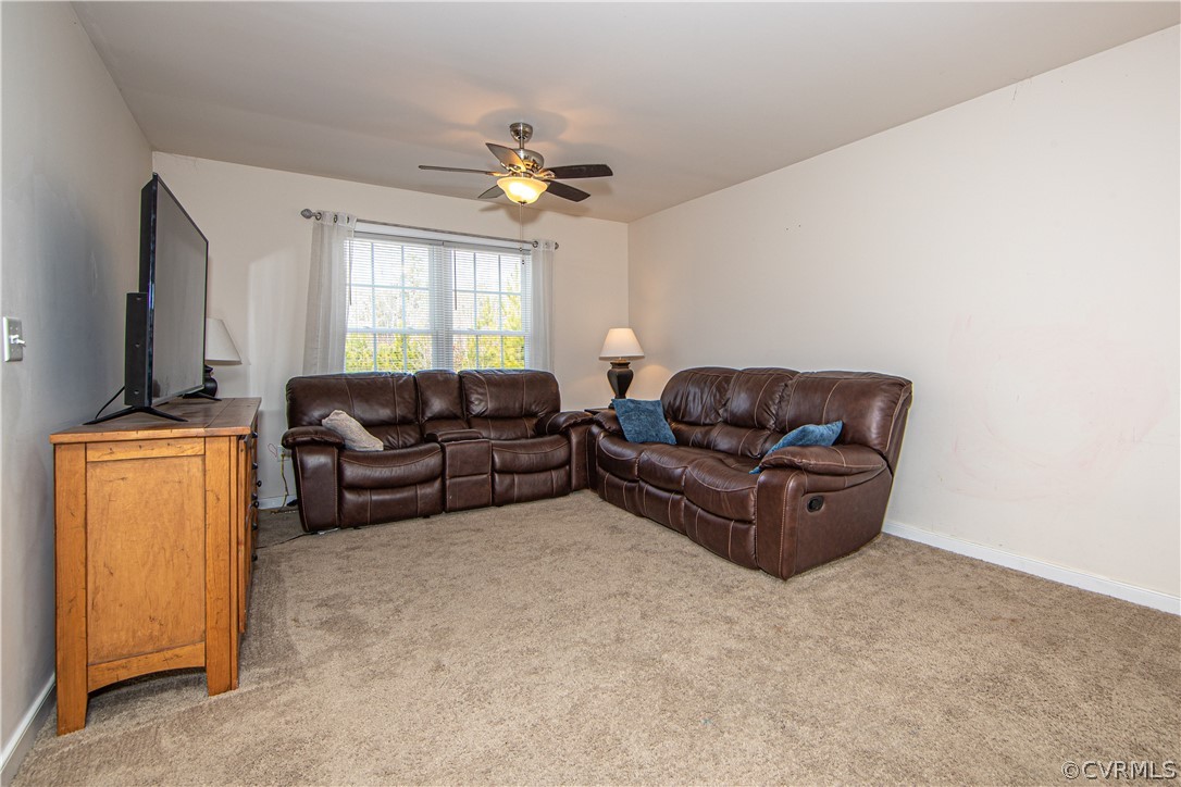 18951 Lundys Road Dinwiddie, VA 23841 - Photo 8 of 27 a living room with furniture and a flat screen tv